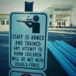 Armed-Teacher-Sign-555×414