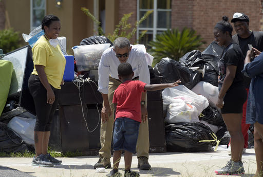 President Obama Tours Flood-Ravaged Neighborhood in Louisiana | News